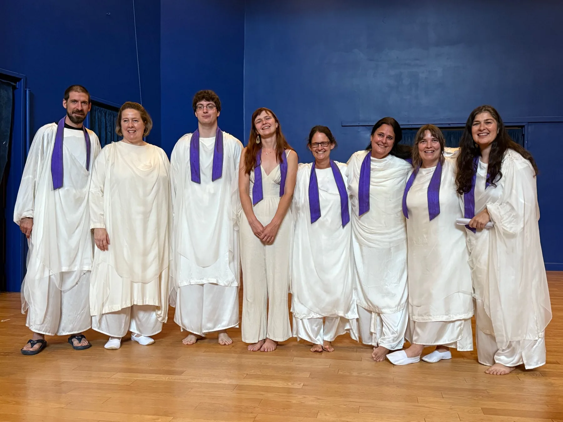Graduates in white robes with stoles